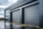 bica-shades-industrial-style-rolling-shutter-garage-door-with-silver-metal-slats-closeup-c