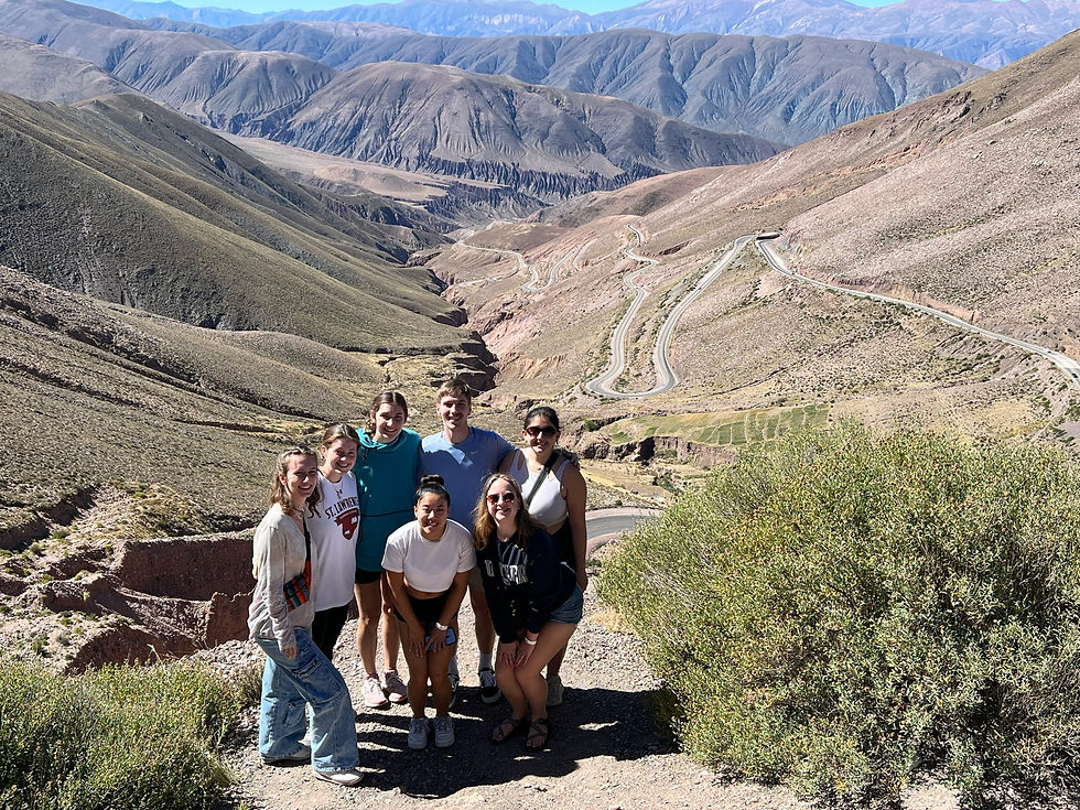 A picture of my friends and I in front of the mountains