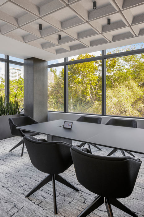 a conference room with a large table and chairs