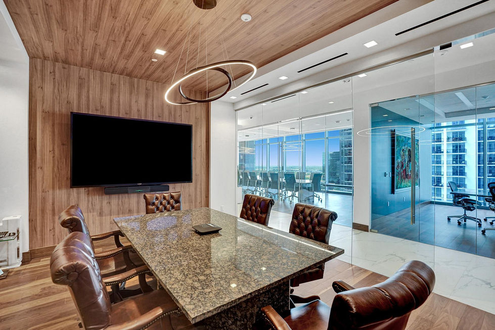 a conference room with a large flat screen tv on the wall