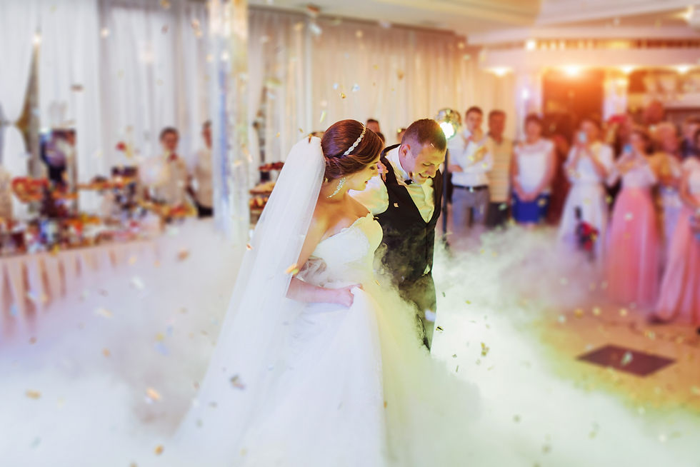 Bride and groom dancing during a wedding reception with professional Wedding DJ entertainment, dancing on the clouds, and intelligent lighting in Orlando, Florida.