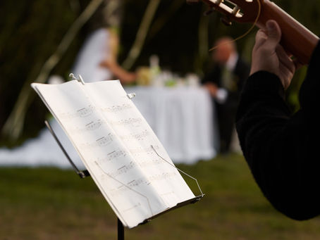Wedding ceremony planning calendar with wedding rings, flowers, and timeline for ceremony music and event coordination in Orlando, Florida.