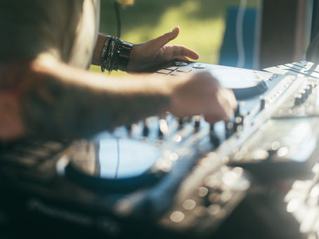 Professional wedding DJ mixing music during a wedding reception in Orlando, Florida.