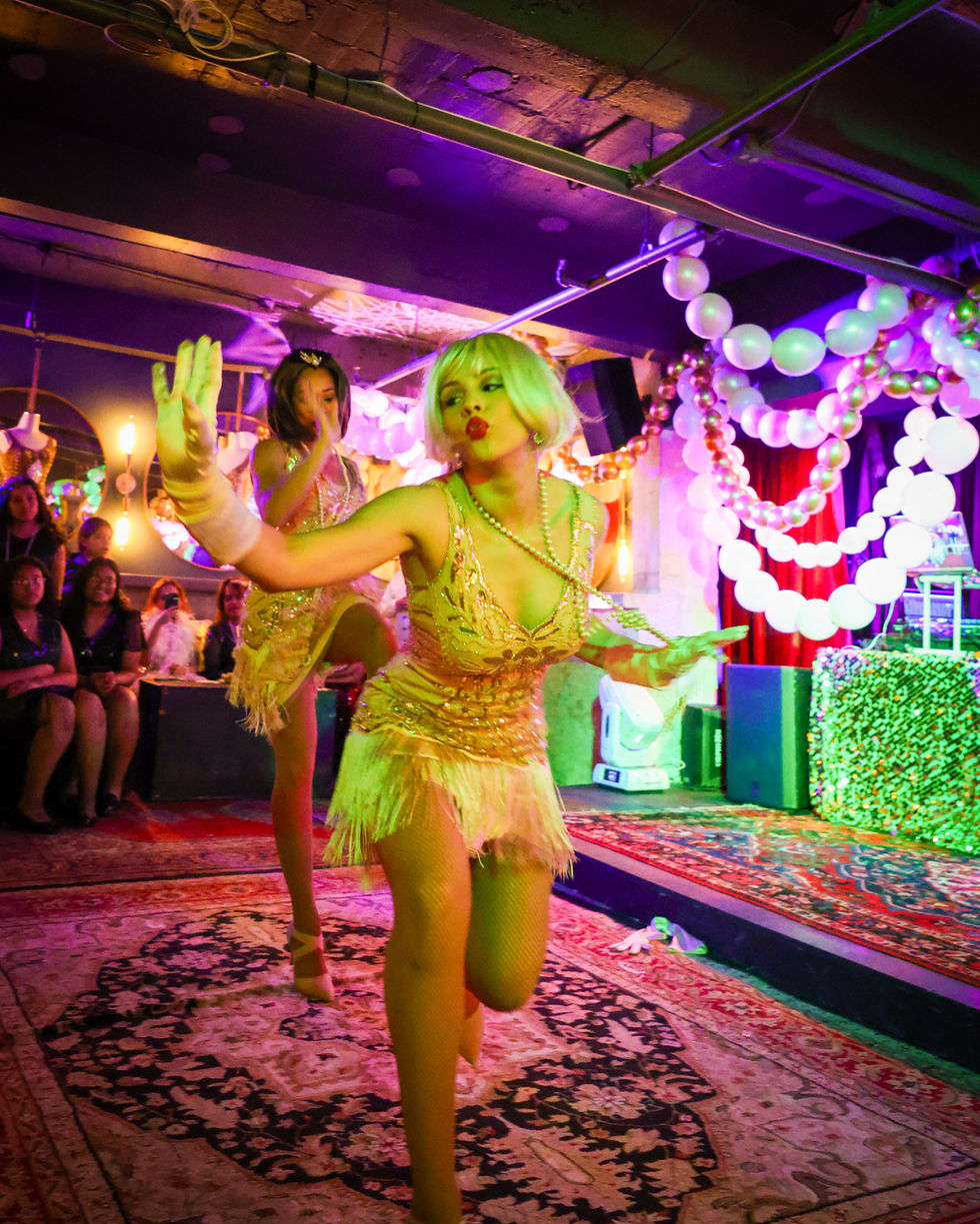 Performers dancing at an event content creation showcase.