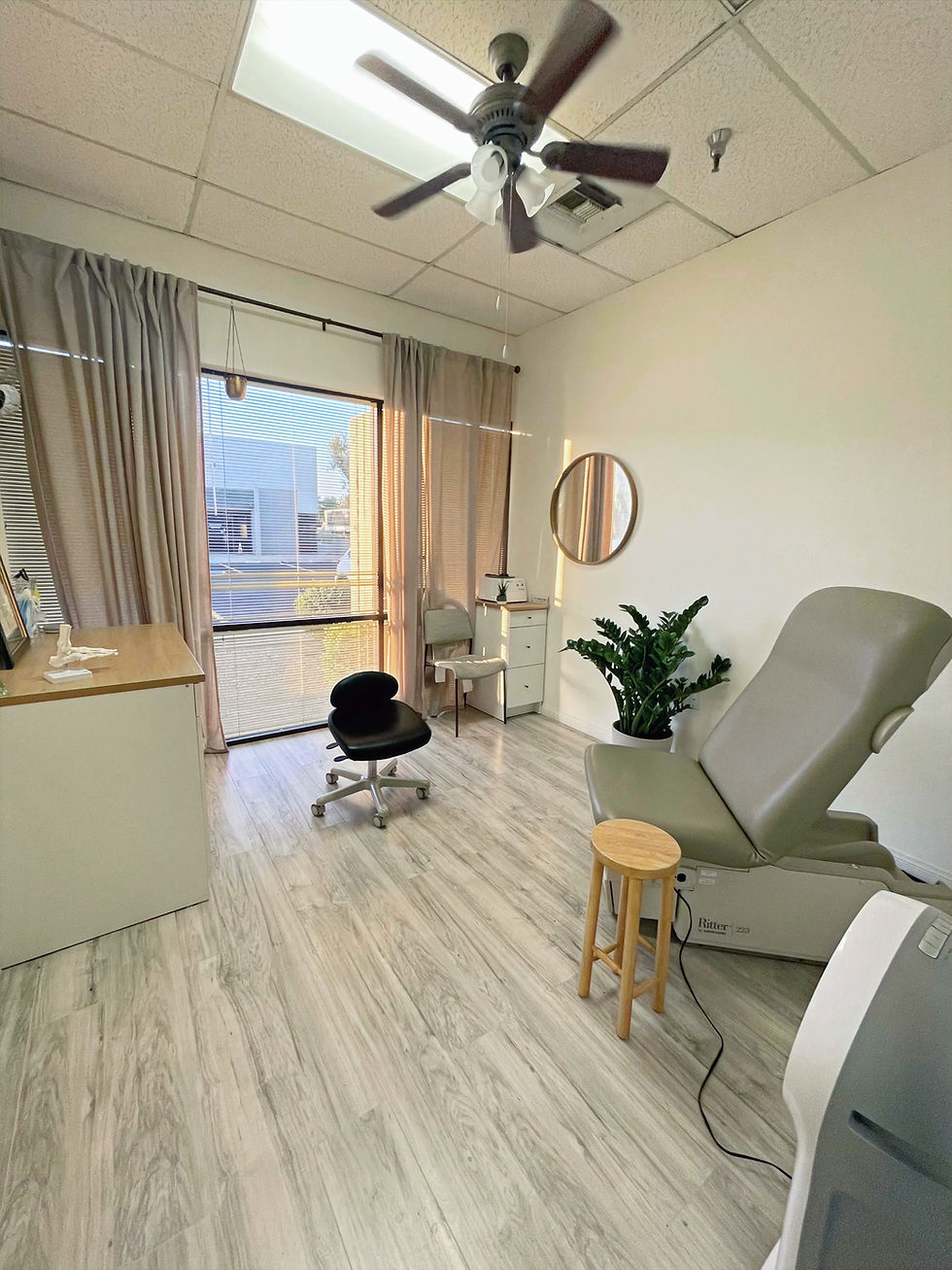 Podiatrist using Remy Class IV laser on toenail fungus patient in Phoenix clinic