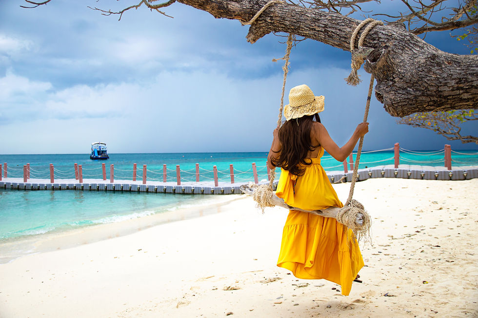 woman-yellow-dress-sat-swing-looking-sea.jpg