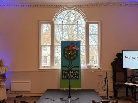 A stage with poster of Local Author Showcase at the Faversham Literary Festival