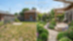 Before and after backyard transformation created with an AI landscape design generator, showing a dry lawn converted into a lush garden with deck, plants, pathway, and outdoor lighting.