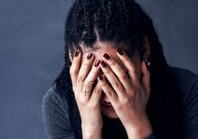 grief woman head in hands