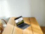 mockuuups-macbook-pro-mockup-on-a-dining-table-against-a-white-background.jpeg