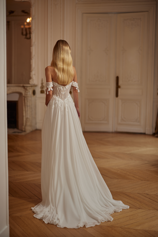 A soft a line lightweight  chiffon wedding dress with a deep v neckline and lace detailing. 