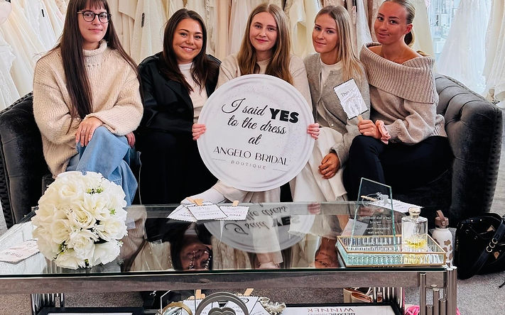 Angelo Bridal team welcoming brides inside luxury Dublin bridal boutique