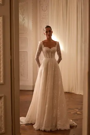 A glittering chantilly lace a line wedding dress with long sleeves, a sweetheart neckline and sensual semi sheer bodice.