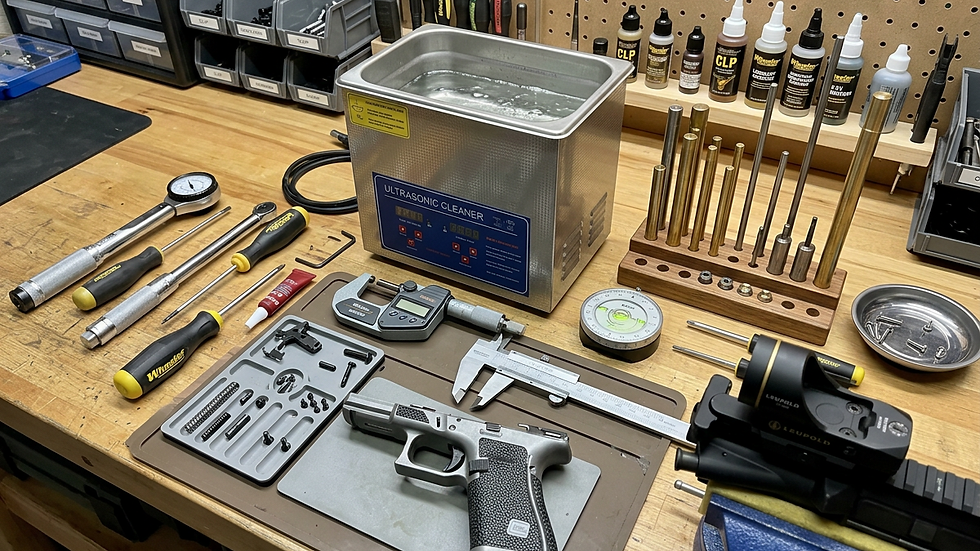 Eye-level view of a gunsmith’s workbench with tools and firearm parts