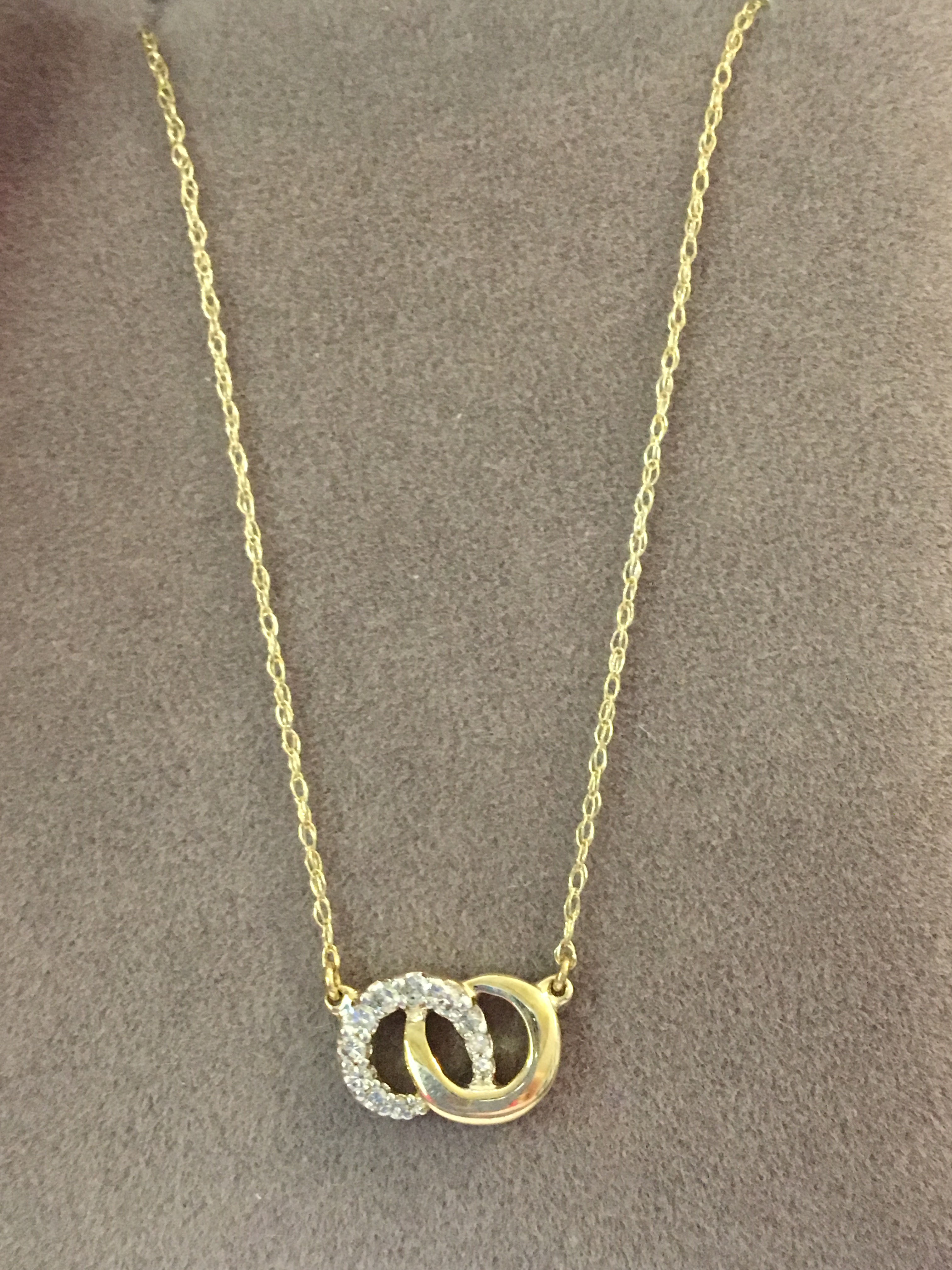 14K yellow gold infinity with eleven 1/10 of a carat diamonds