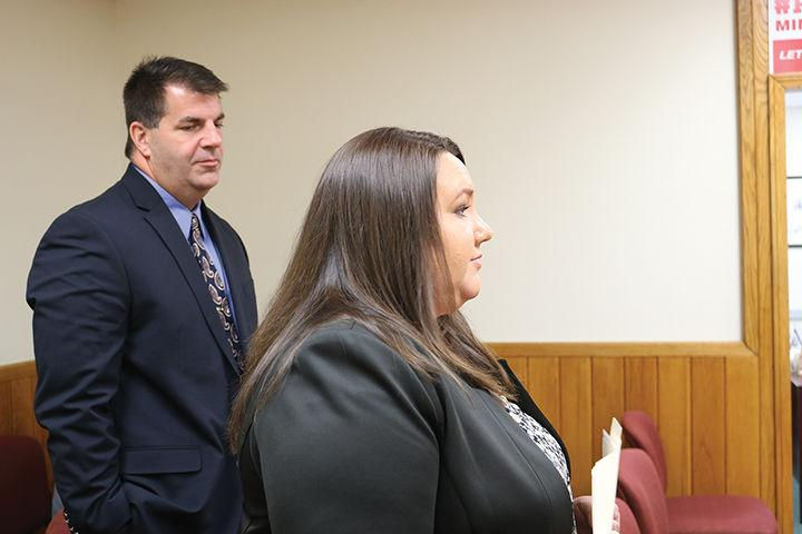 Greta Curry, deputy executive director of the Mingo County Redevelopment Authority, and Jon Webster, manager of External Affairs for Appalachian Power, address the Mingo County Commission seeking support of AEP’s middle-mile broadband initiative. Mingo Messenger photo by Terry L. May