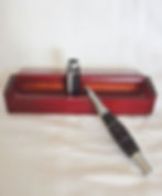 Black and silver pen on wooden box