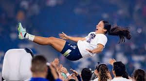 Bernal being tossed in the air after winning her fourth Liga MX Femenil title with her C.F. Monterrey teammates