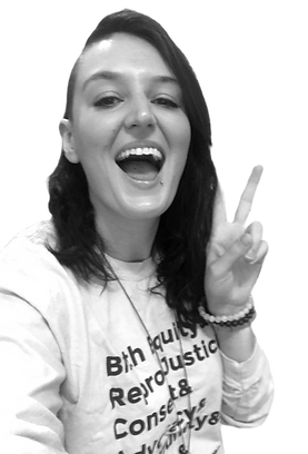 smiling doula with reproductive justice shirt on