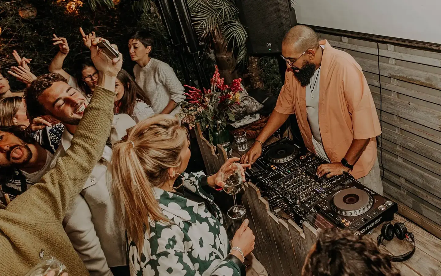 DJ set at Kabana rooftop with guests dancing and enjoying cocktails during a lively night in Marrakech.