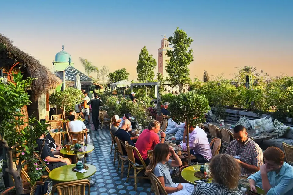 Lively atmosphere at Kabana rooftop garden terrace in Marrakech during the afternoon