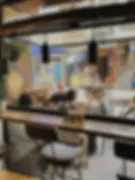 Scenic window seating at Mandala Society Essaouira, overlooking the vibrant Medina with a cozy and inviting café atmosphere.