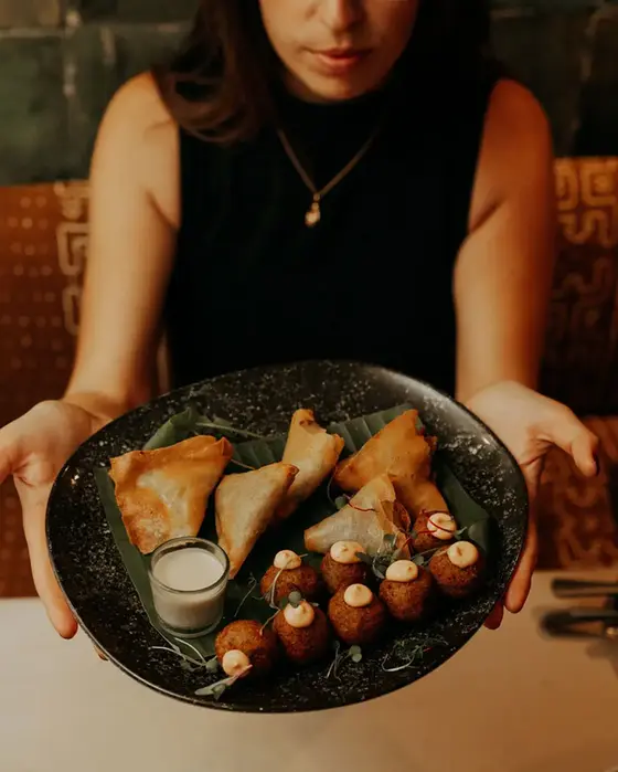 African fusion starters served at BlackChich restaurant, including samosas and croquettes