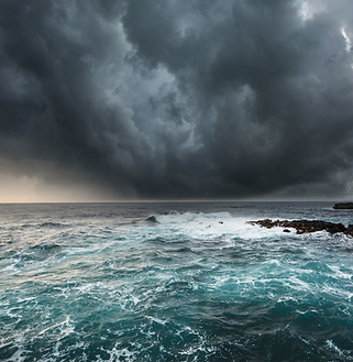 A storm is approaching over the ocean. This is a visual metaphor for Anxiety