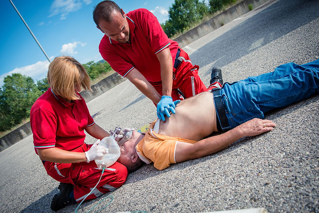Paramedics succor a man with heart attac