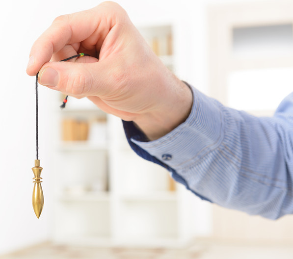 Hand Holding Pendulum