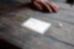 A Rohingya man confined to an internment camp in Myanmar’s Rakhine State displays his “white card”—an identification document revoked by former Myanmar President Thein Sein. Myanmar stripped Rohingya of equal access to citizenship rights in 1982, heightening the risk of being trafficked for Rohingya. ©Fortify Rights, 2015