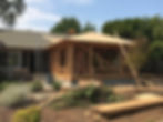 Framing underway for an addition on the back of a house
