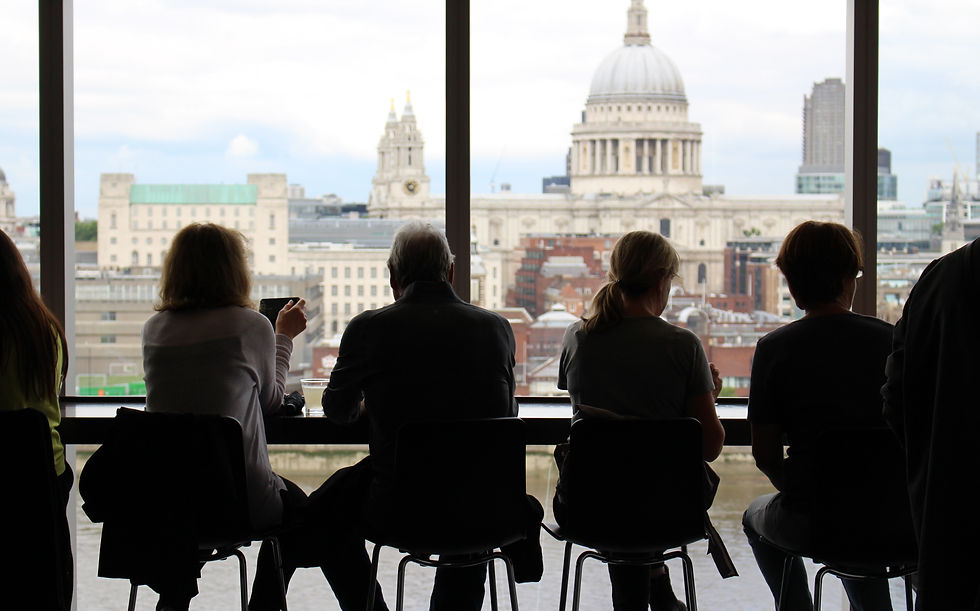 People having a conversation by the window