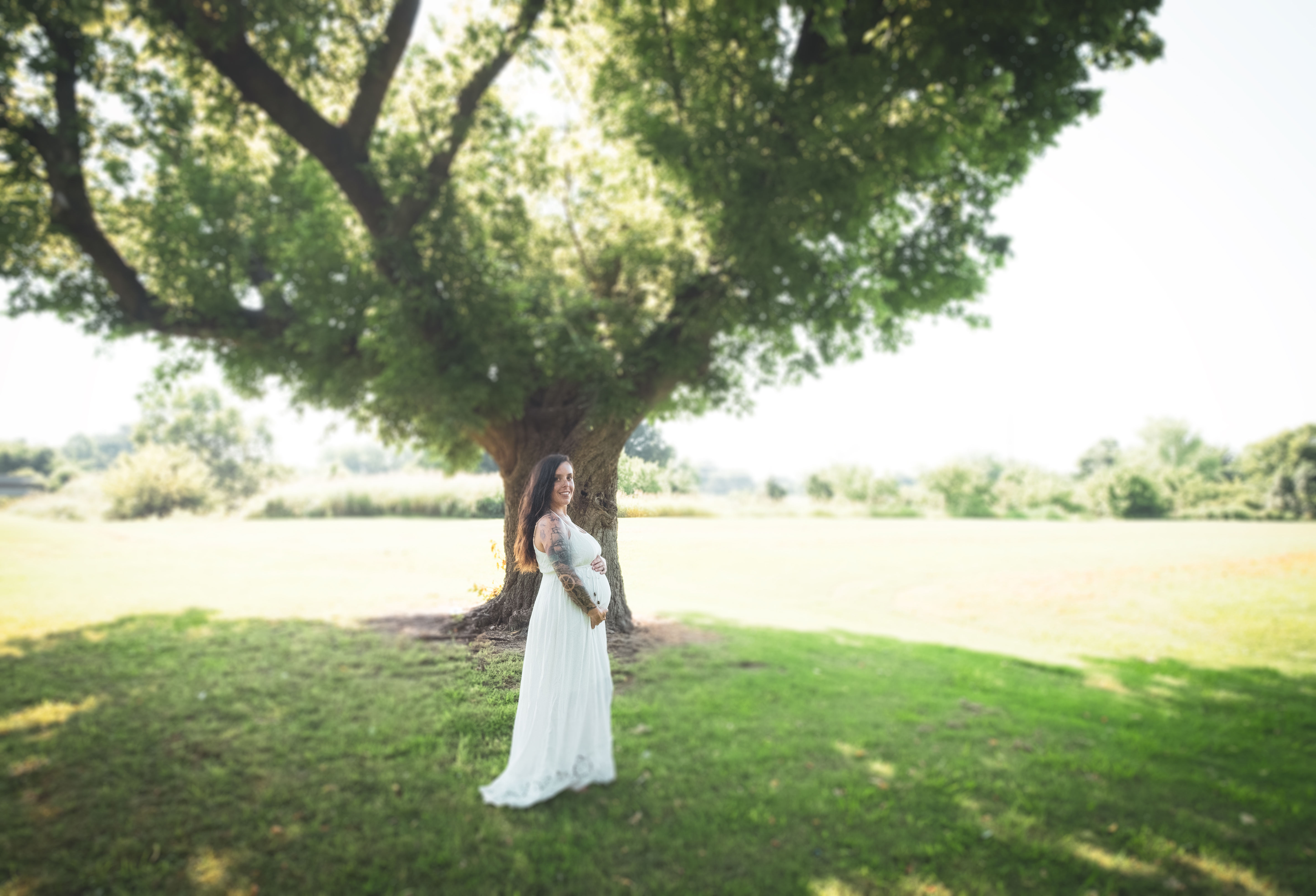 Pregnant woman in white dress