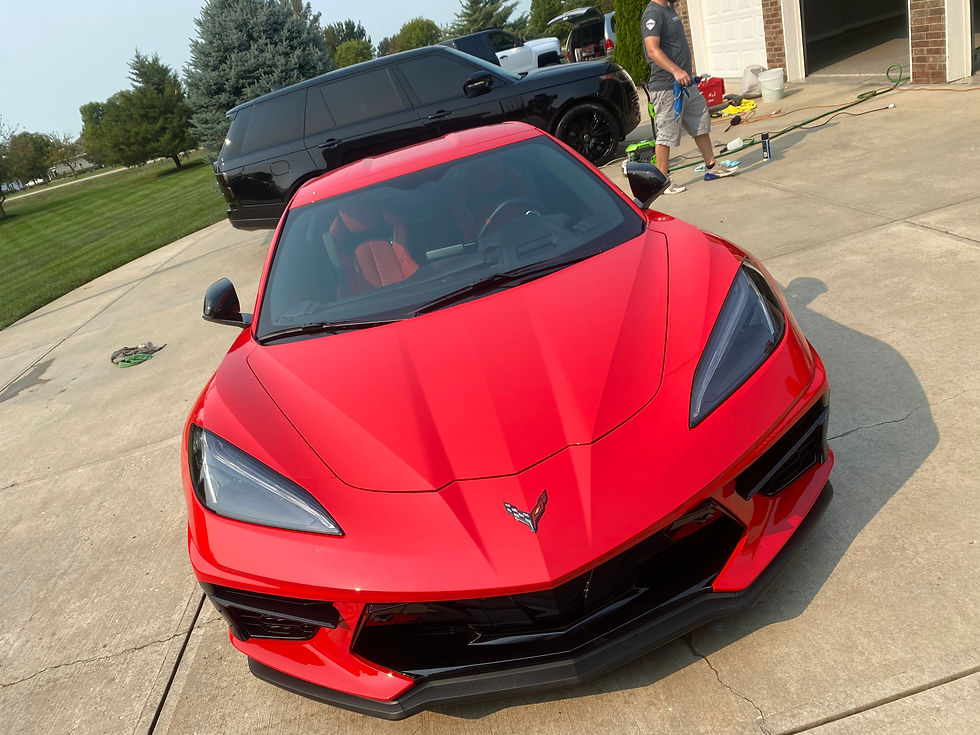 A super detailed luxury car gleams in the sunlight, showing off expert craftsmanship and precision for a perfect finish.