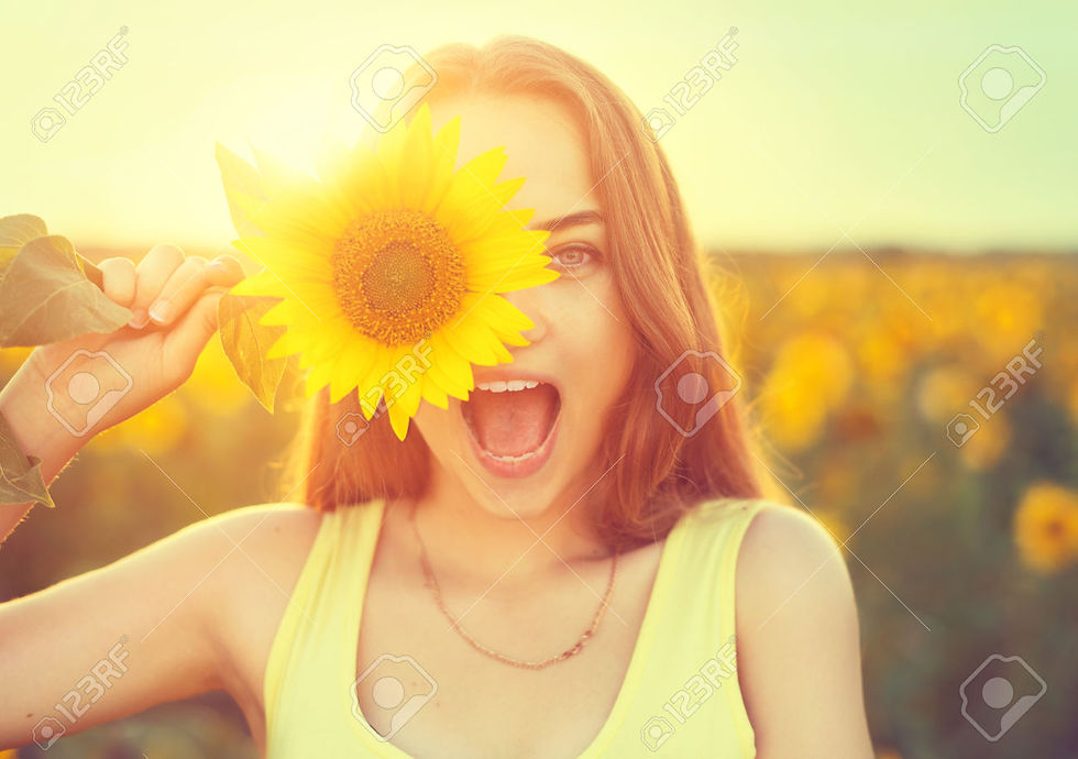 Stock Photo - Beauty joyful teenage girl with sunflower