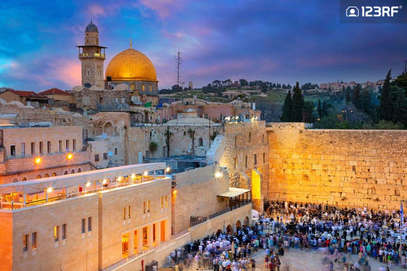 A Tribute to Anthony Bourdain: Top 10 ‘Parts Unknown’ Cities to Visit 123RF Blog - The Dome of the Rock and Wailing Wall at sunset