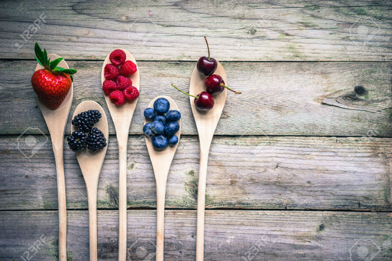 36129843-berries-on-wooden-rustic-background