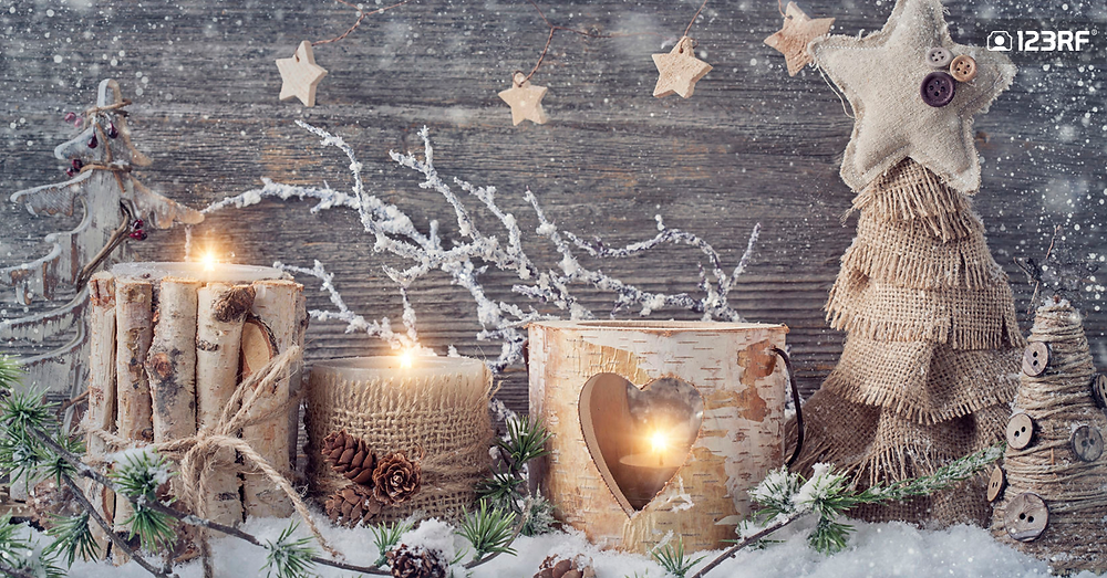 Stock Photo - Winter candles on a wooden background