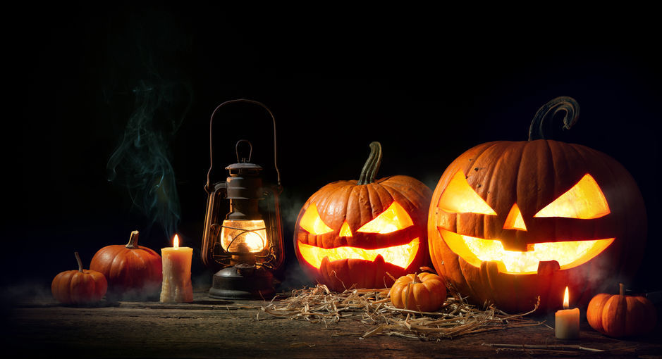 Halloween pumpkin head jack lantern with burning candles
