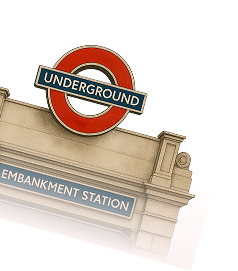 London Underground entrance sign with text reading 'UNDERGROUND' and 'EMBANKMENT STATION'.