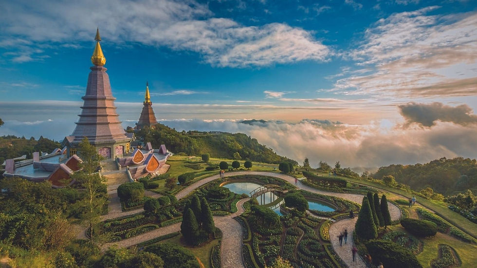 Scenic view of pagodas and gardens with clouds and blue sky