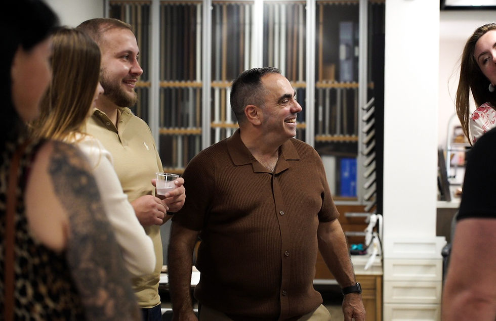 Kitchen design team discussing project with clients
