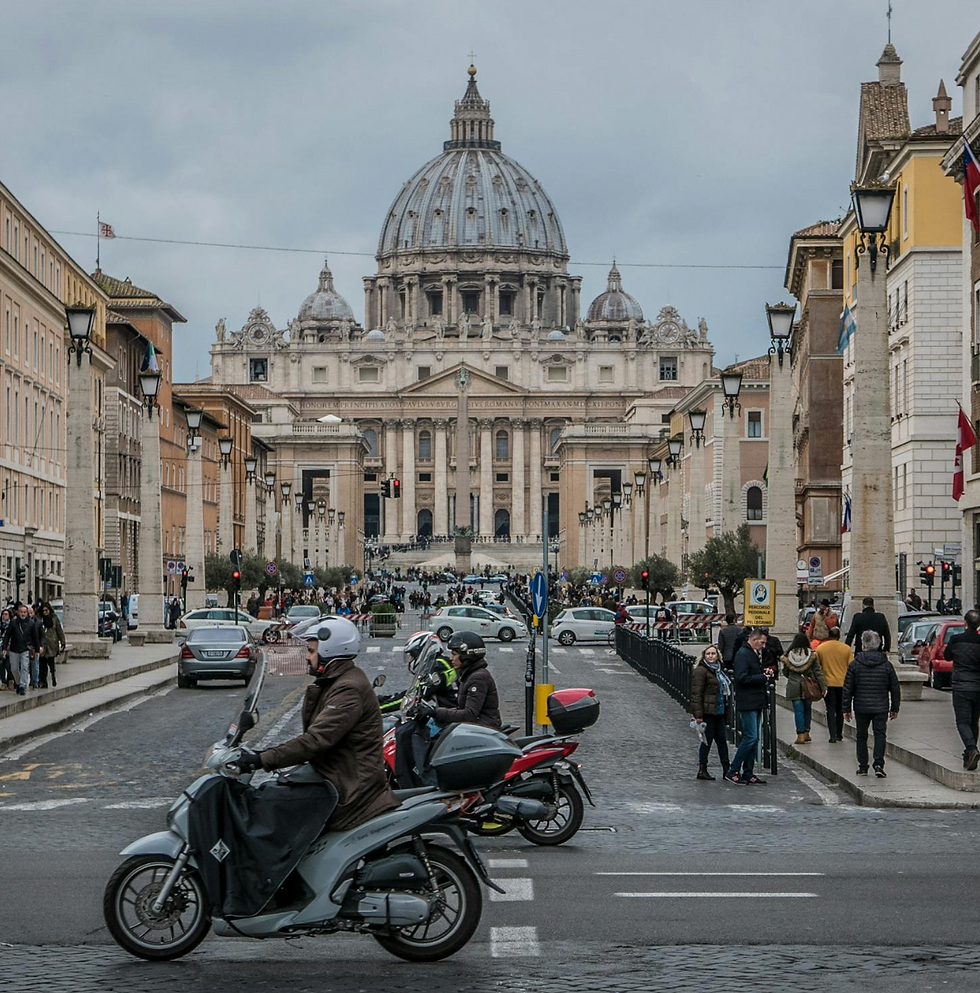 Scooter on street in front of St. Peter's Basilica, Rome, Italy