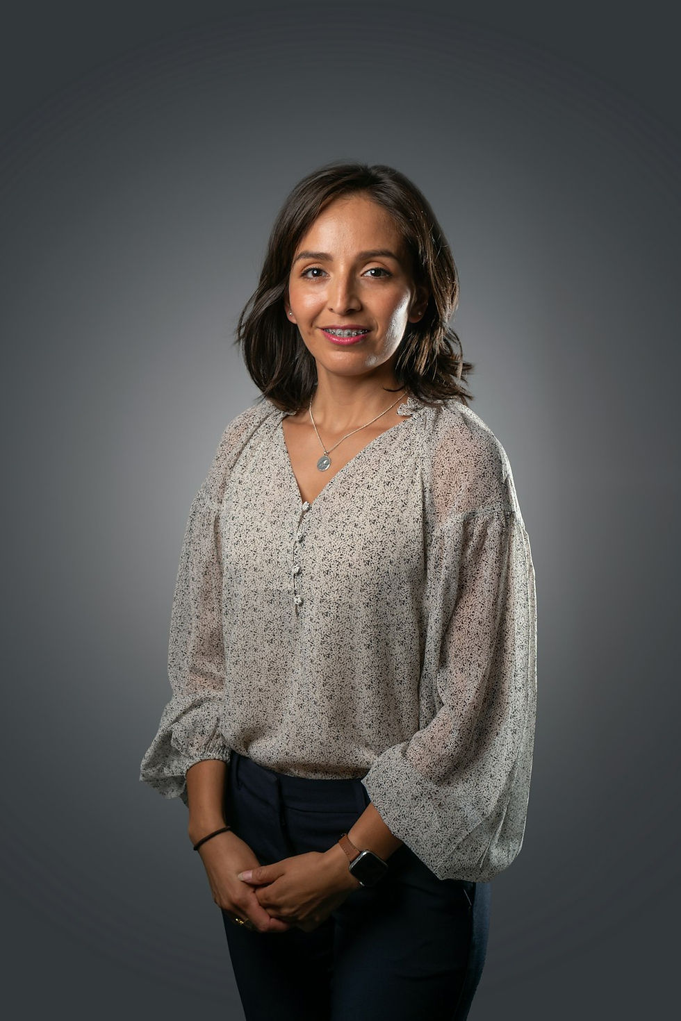 Woman with short dark hair smiling