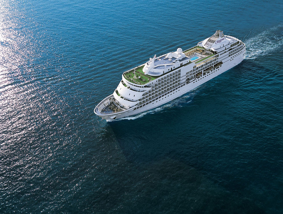 White cruise ship sailing on the sea, aerial view, Regent Seven Seas cruises.