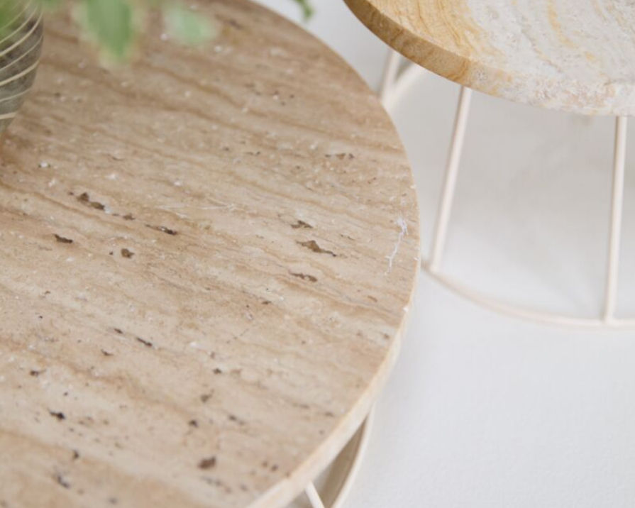 Thumbnail: Natural stone display riser with a round top and minimalist metal base, used to elevate plants or decorative objects on a tab