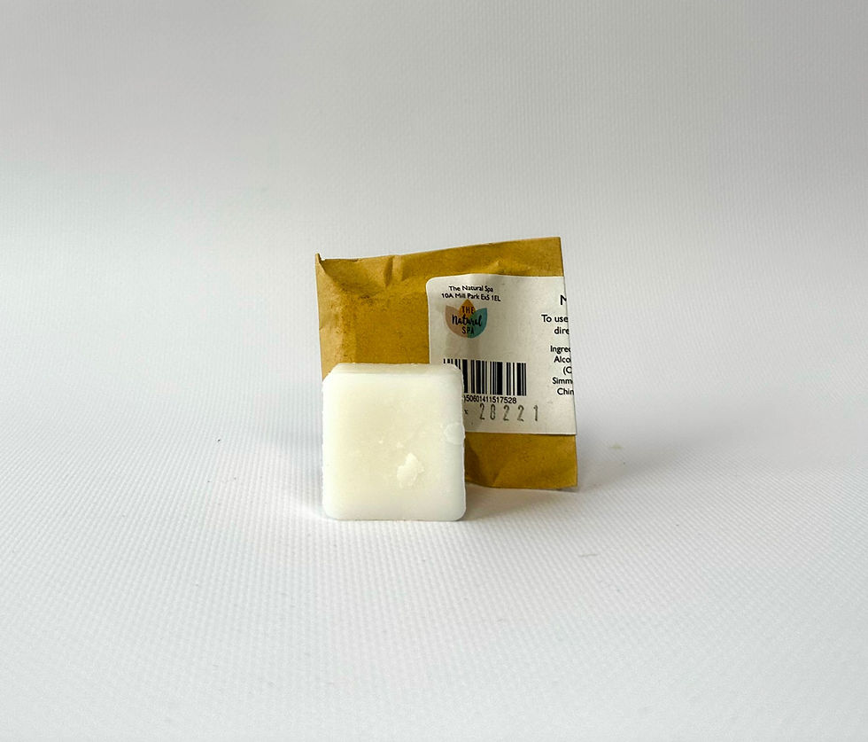 White soap bar beside packaging