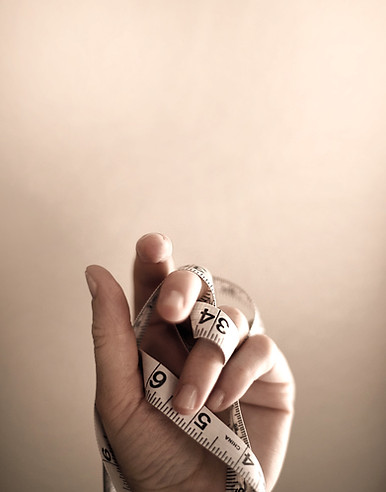 person's left hand wrapped by tape measure_edited.jpg