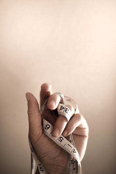 person's left hand wrapped by tape measure_edited.jpg